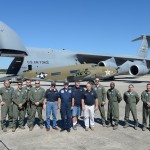 Team photo showing the aircrew and Air Mobility Command Museum aircraft recovery team in front of a Lockheed C-60 LoadStar and the aircraft which will transport it to the AMC Museum, a C-5M Super Galaxy, Oct. 5, 2014, at Warner-Robins Air Force Base, Ga. The C-60 will be reassembled, restored and placed on display at the AMC Museum in the future. (U.S. Air Force photo/Greg L. Davis)